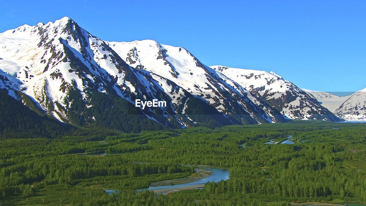 scenic view of mountains against clear blue sky