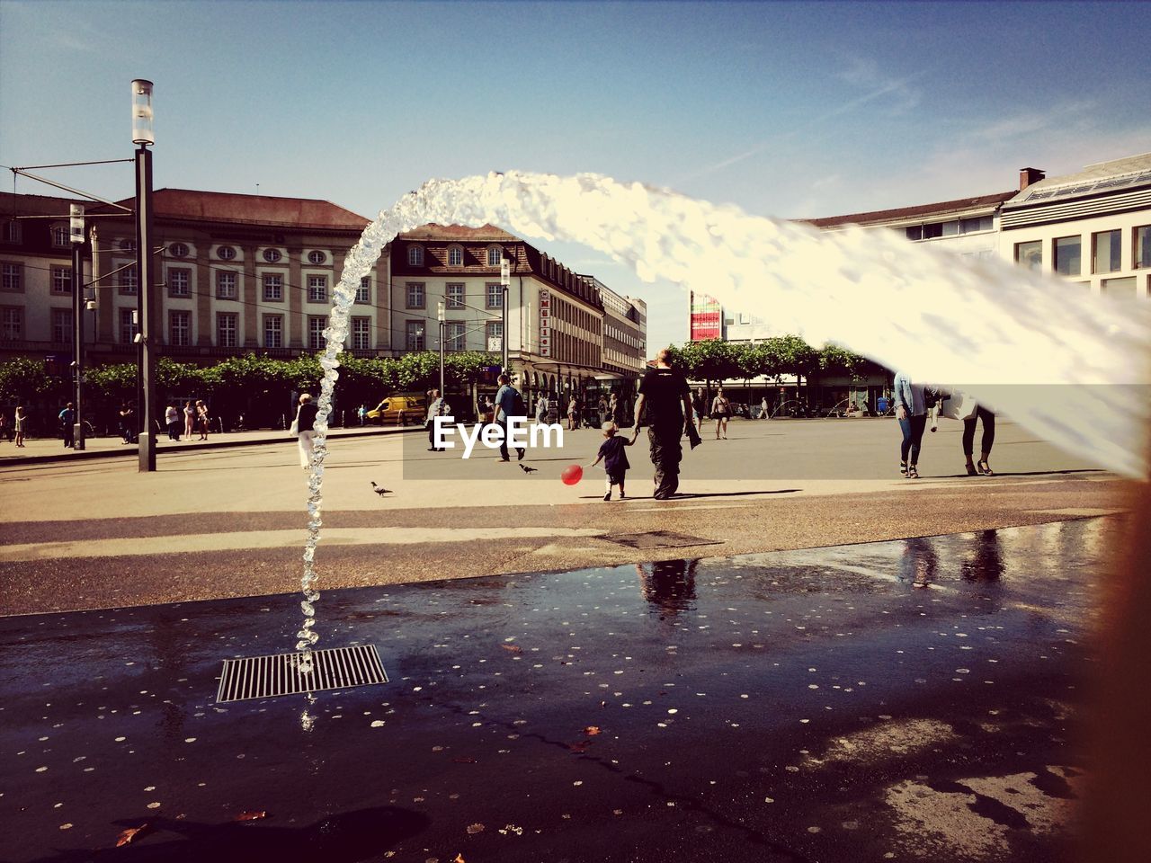 Splashing water on town street