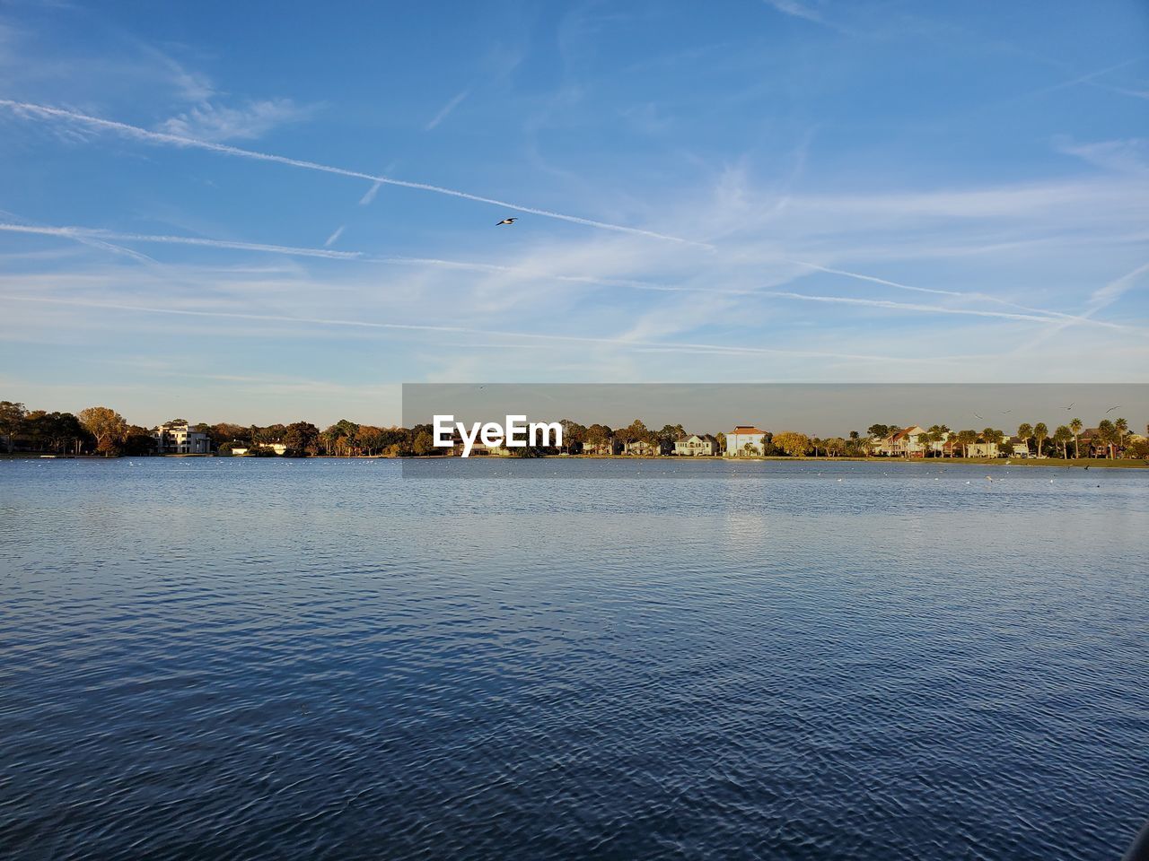 Scenic view of lake against blue sky