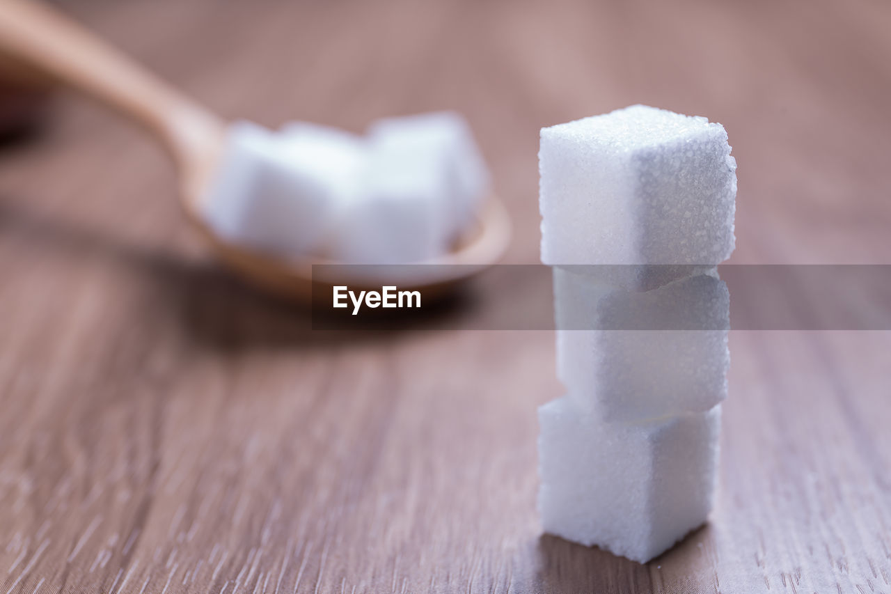 Close-up of sugar cubes on table