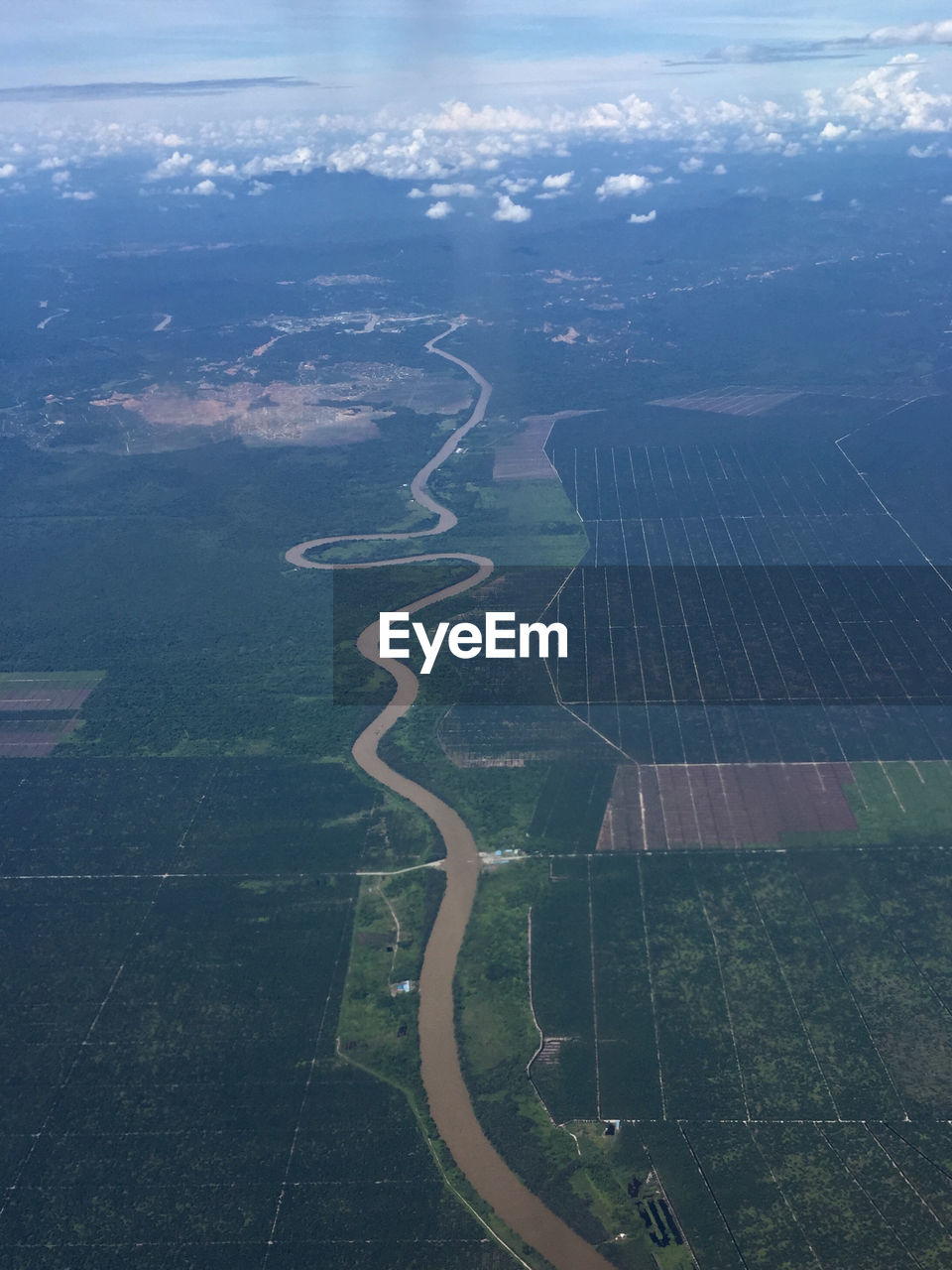 Aerial view of agricultural field against sky