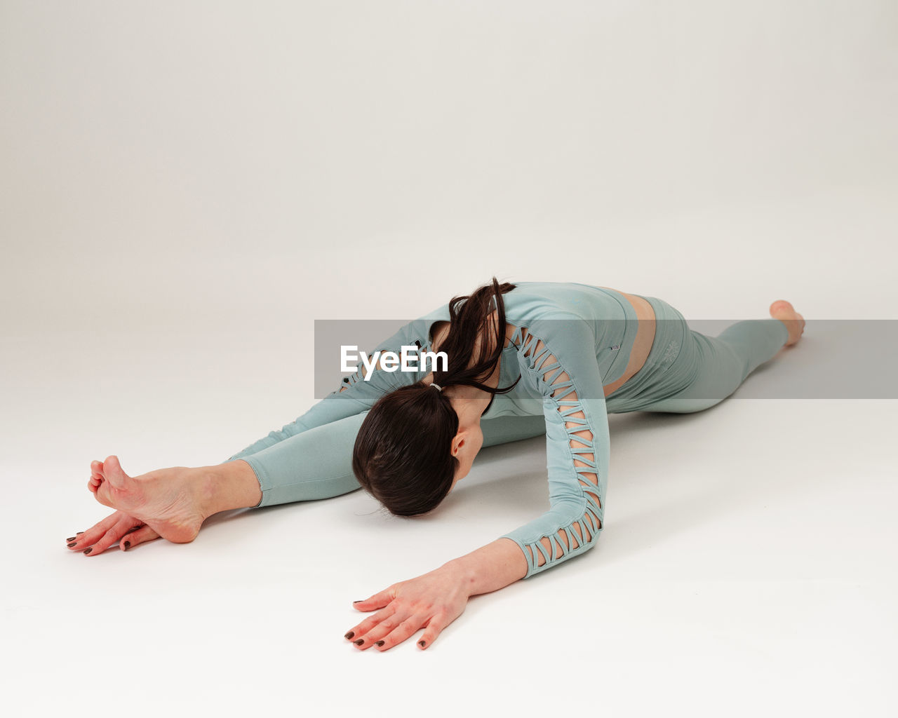 high angle view of woman with tape measure on white background