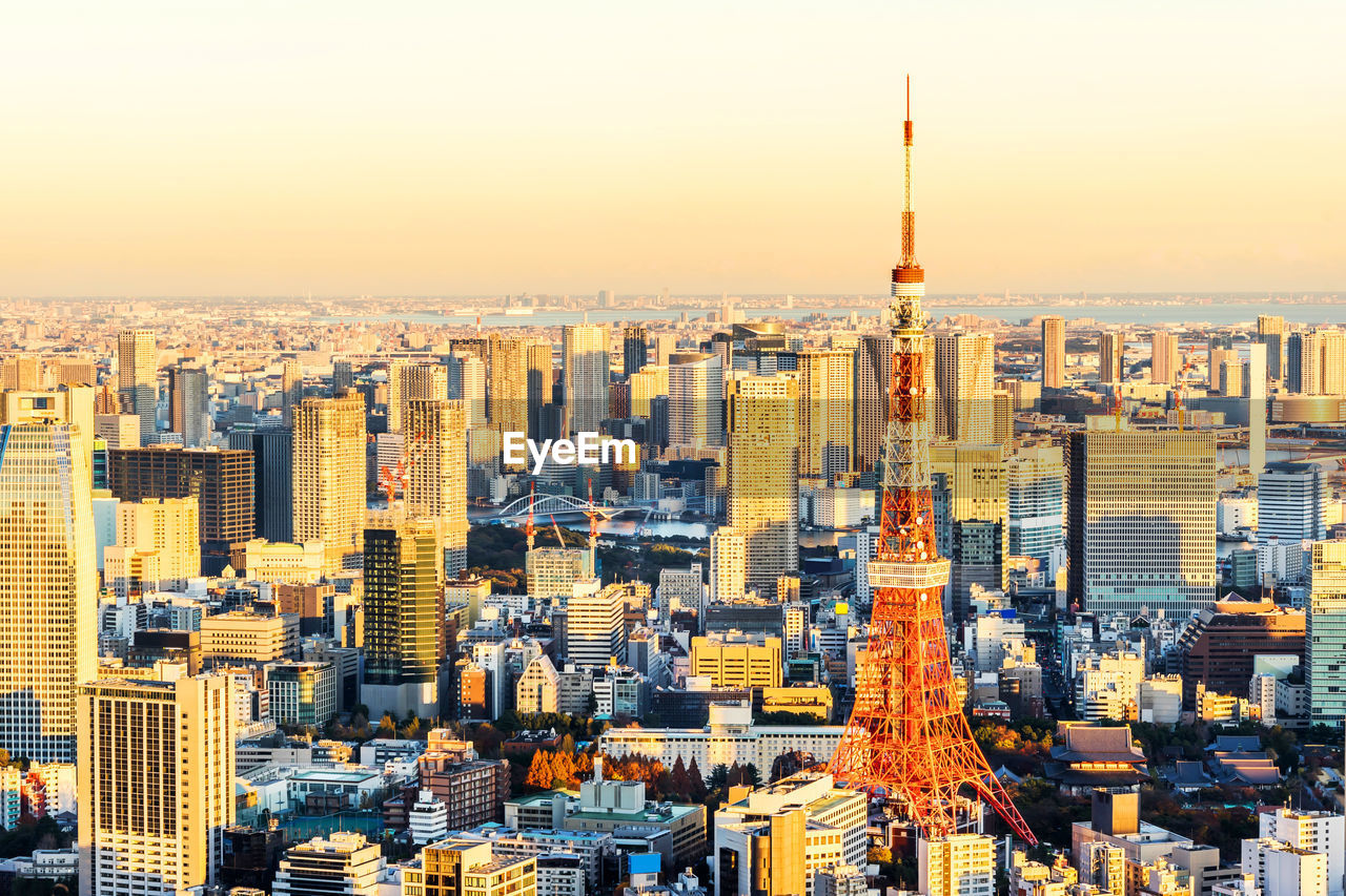 Aerial view of city buildings during sunset