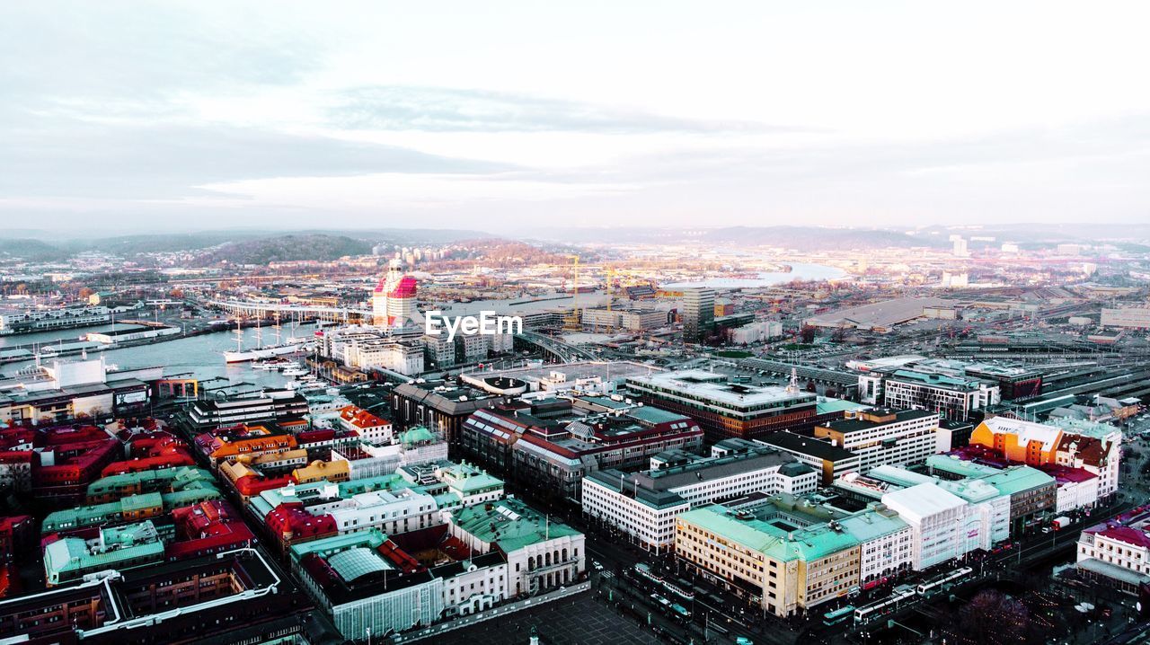 High angle view of buildings in city against sky