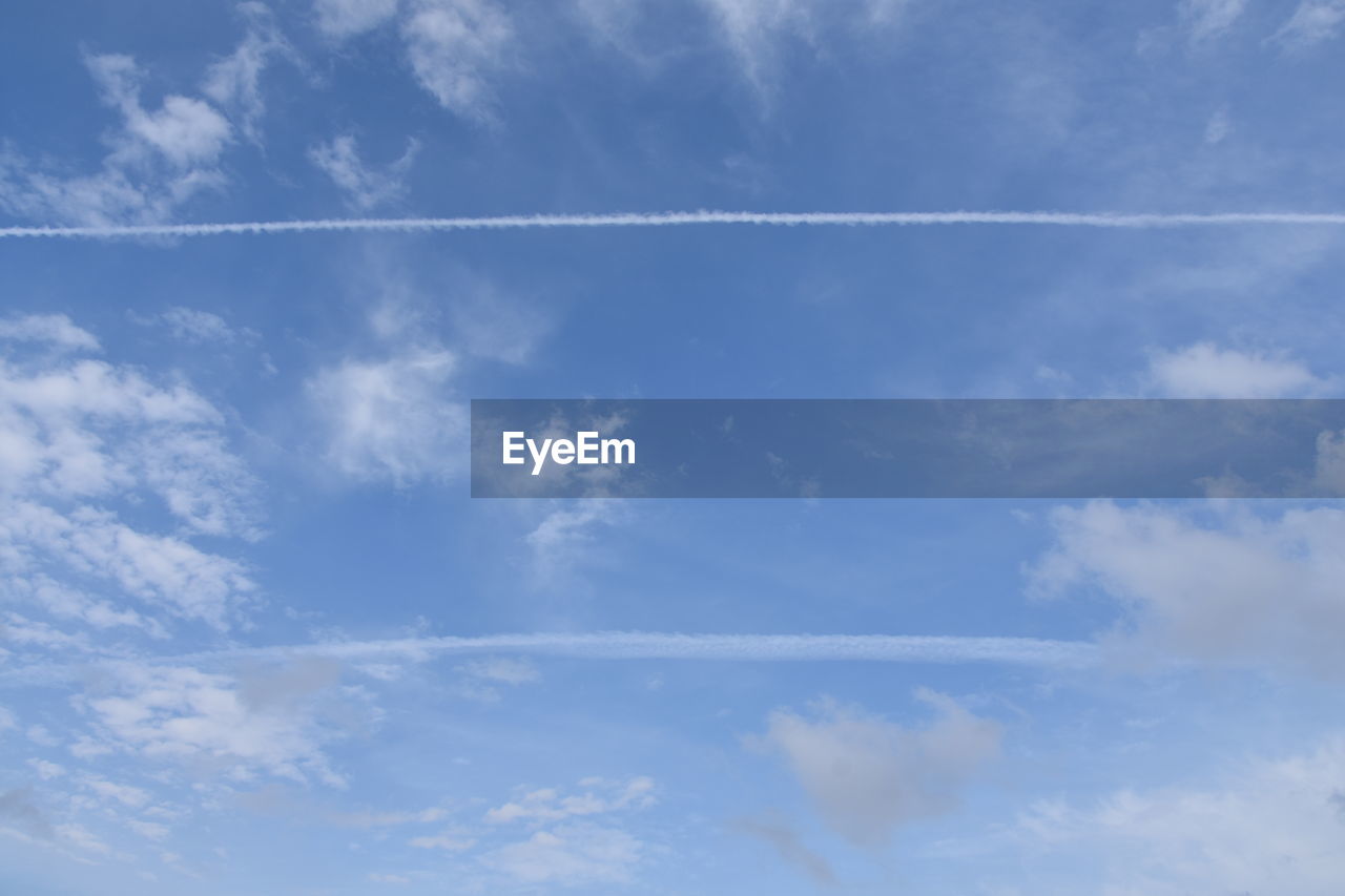 LOW ANGLE VIEW OF VAPOR TRAIL AGAINST SKY