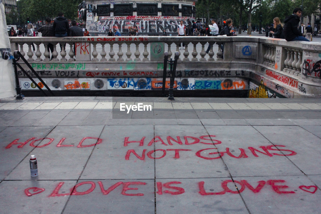 Text on walkway by spray paint