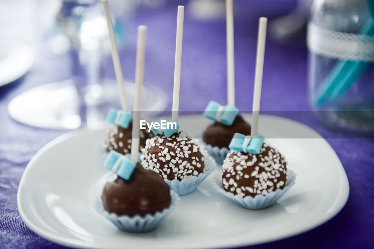 Close-up of cake pops in plate on table