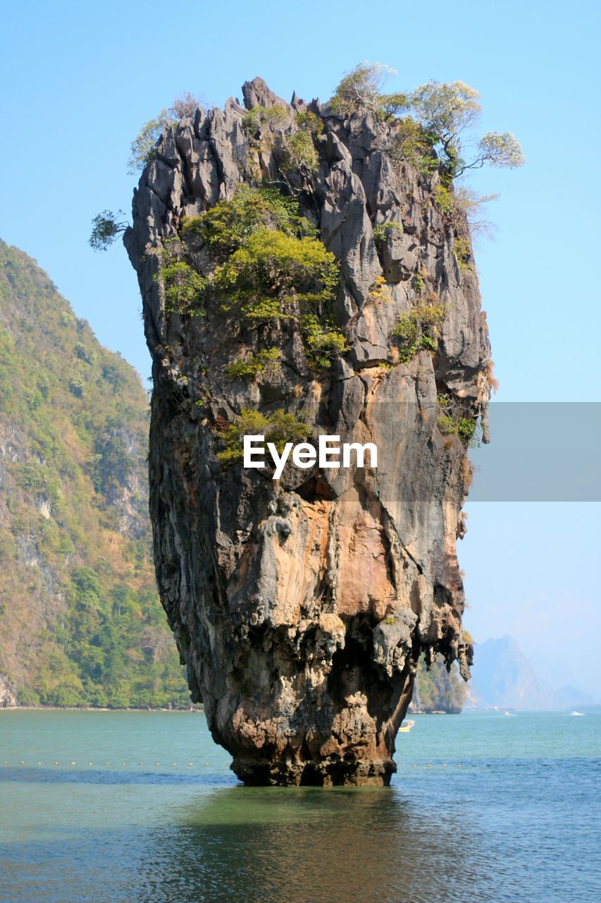 ROCK FORMATION BY SEA AGAINST SKY