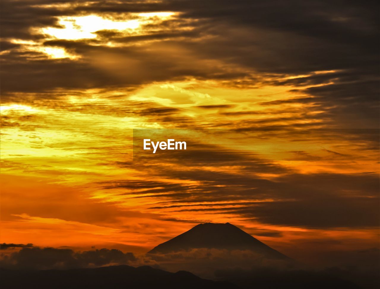 Scenic view of dramatic sky during sunset