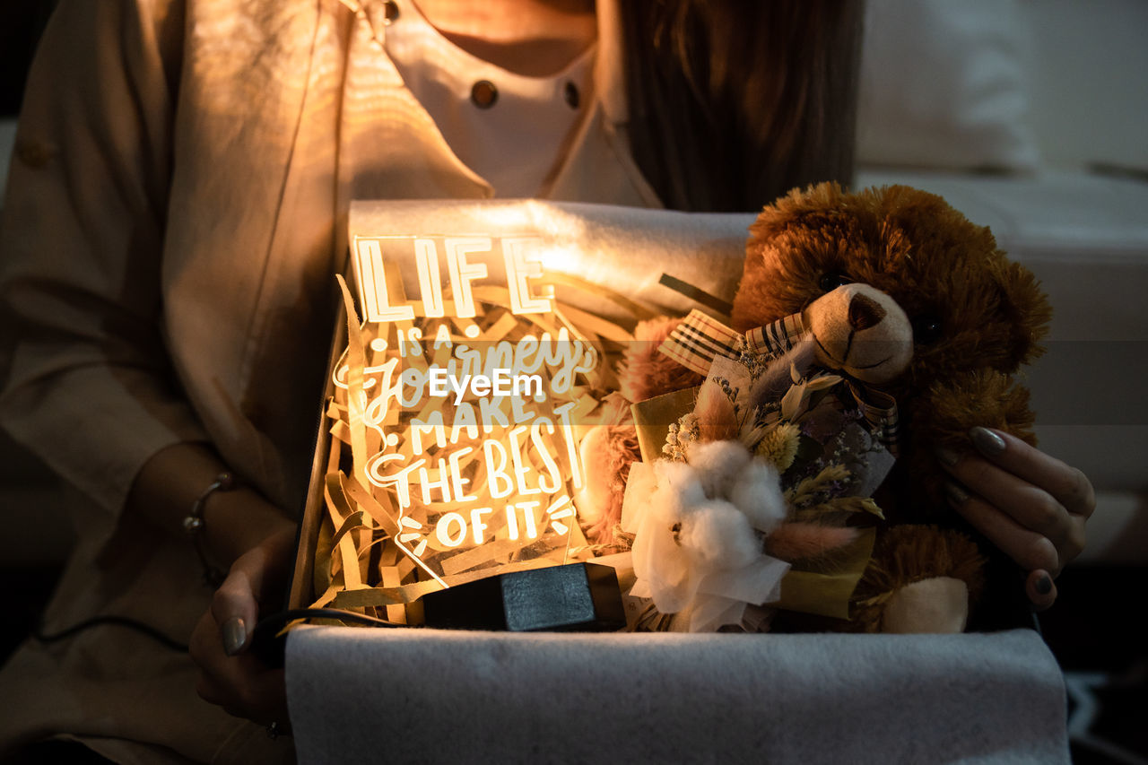 Close-up of woman with gift package