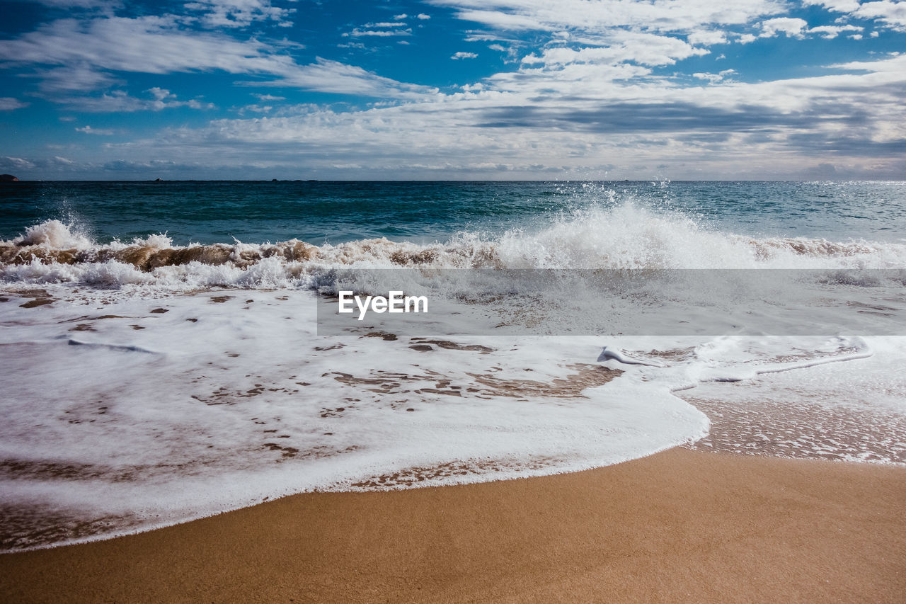 Scenic view of beach against sky