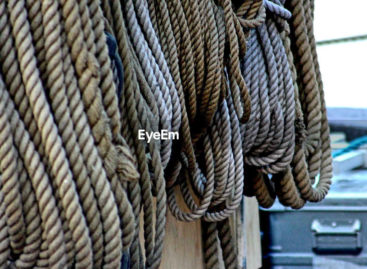 Close-up of rope tied to bollard