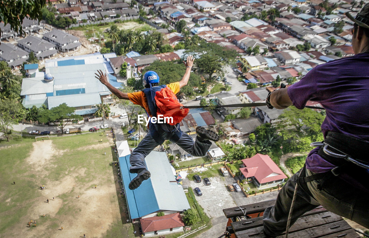 HIGH ANGLE VIEW OF MEN AND PEOPLE IN TRADITIONAL CLOTHING