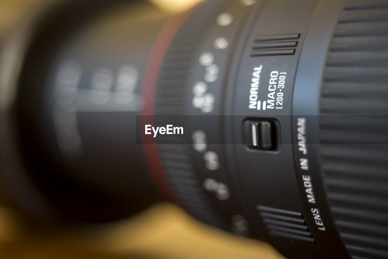 Close-up of camera lens on table