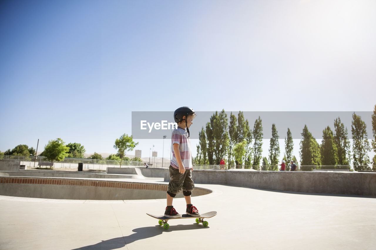 Side view of boy skateboarding on ramp