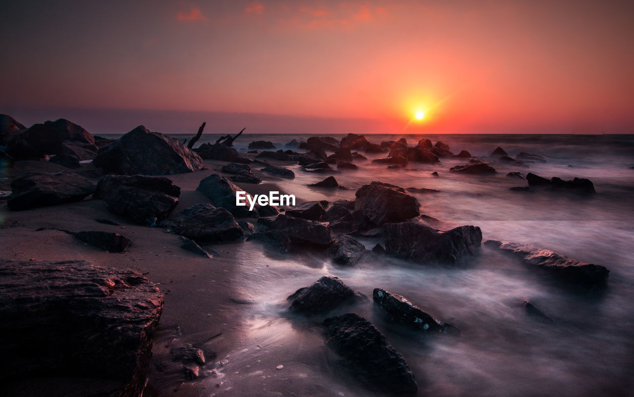 Scenic view of sea against sky during sunset