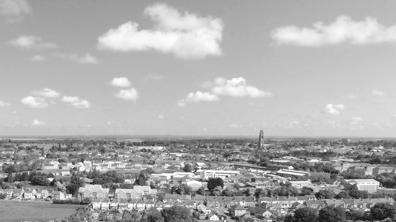 Aerial view of cityscape against sky