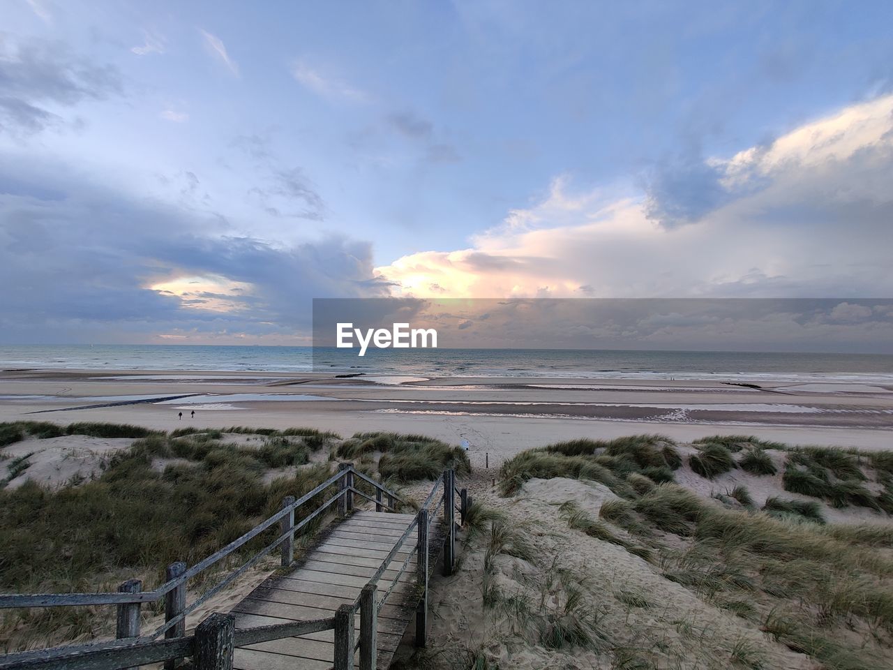 SCENIC VIEW OF SUNSET OVER SEA