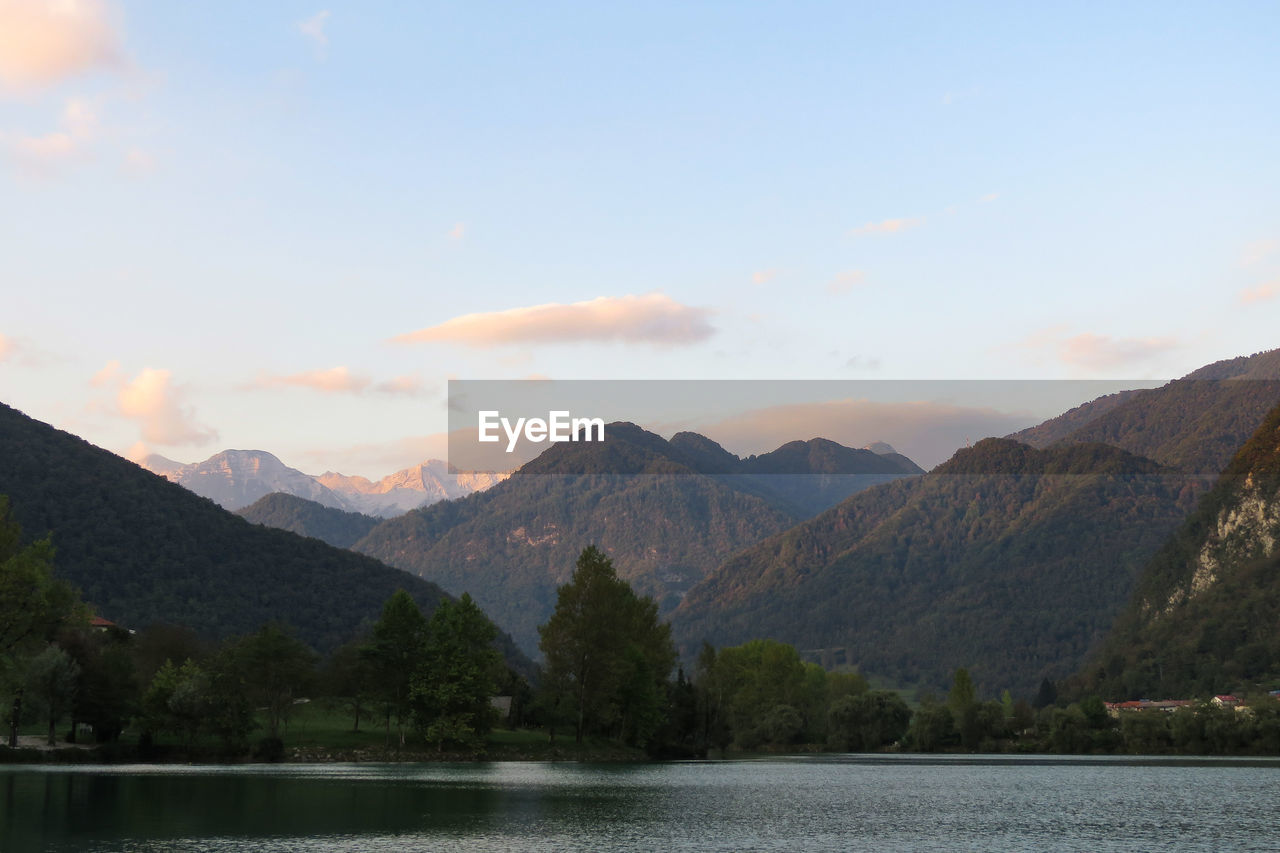 Scenic view of lake and mountains against sky