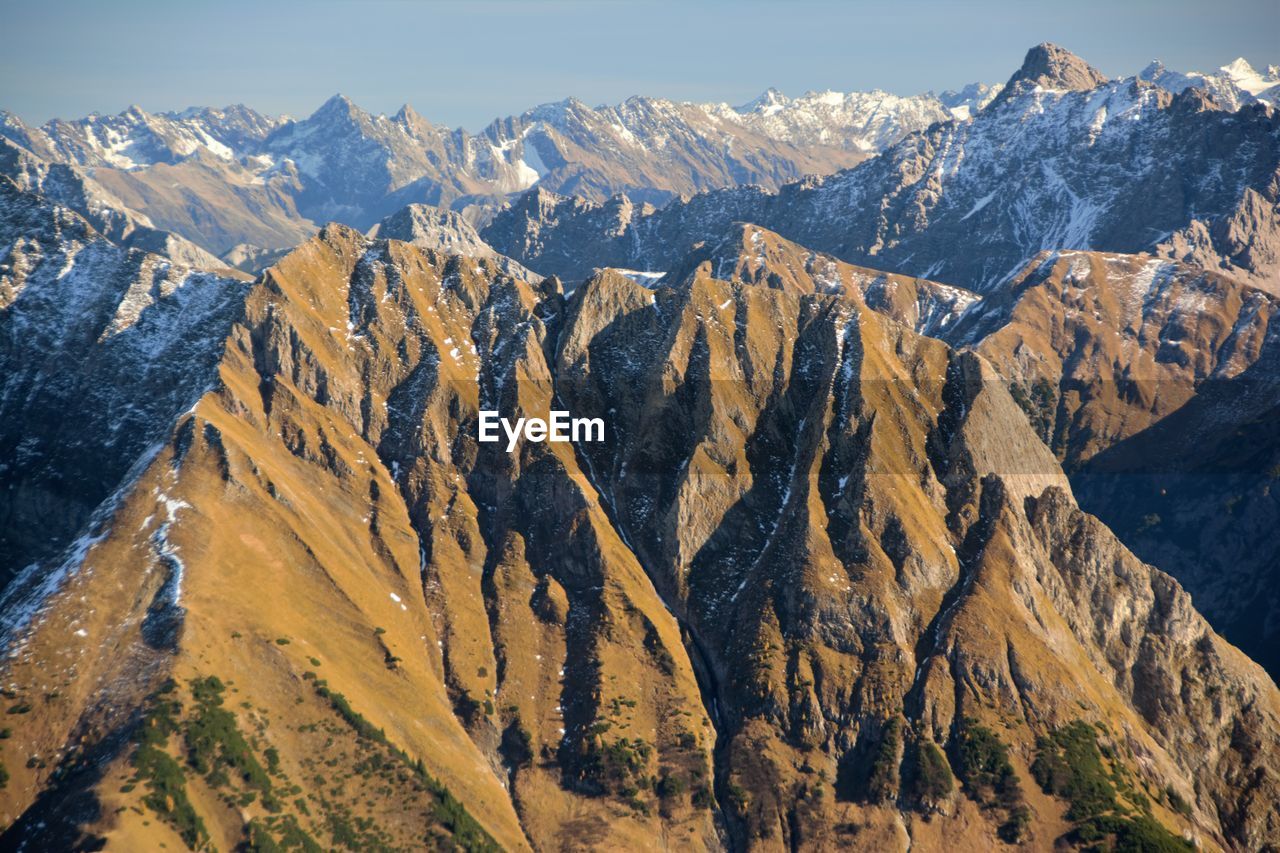 High angle view of snowcapped mountains against sky