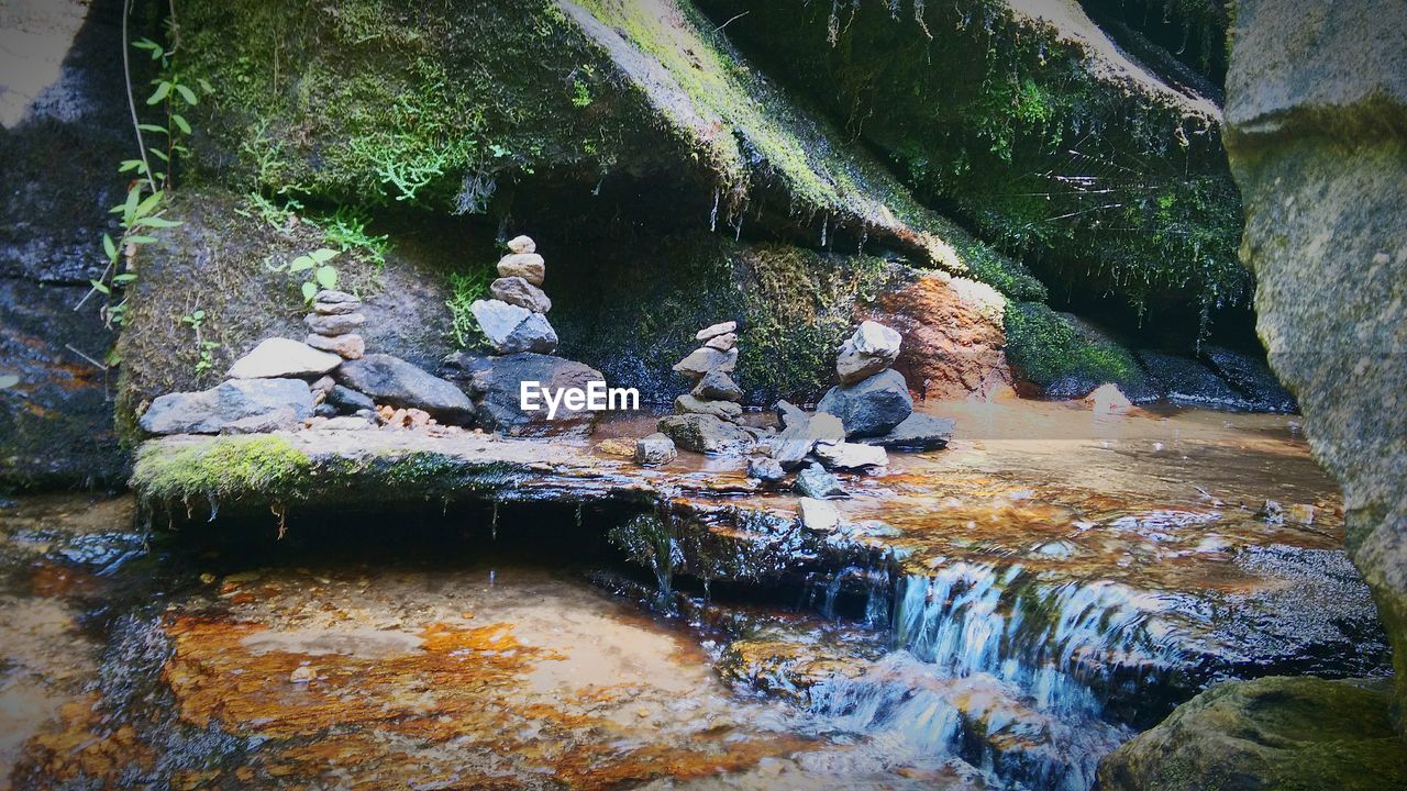 Stacked stones in river