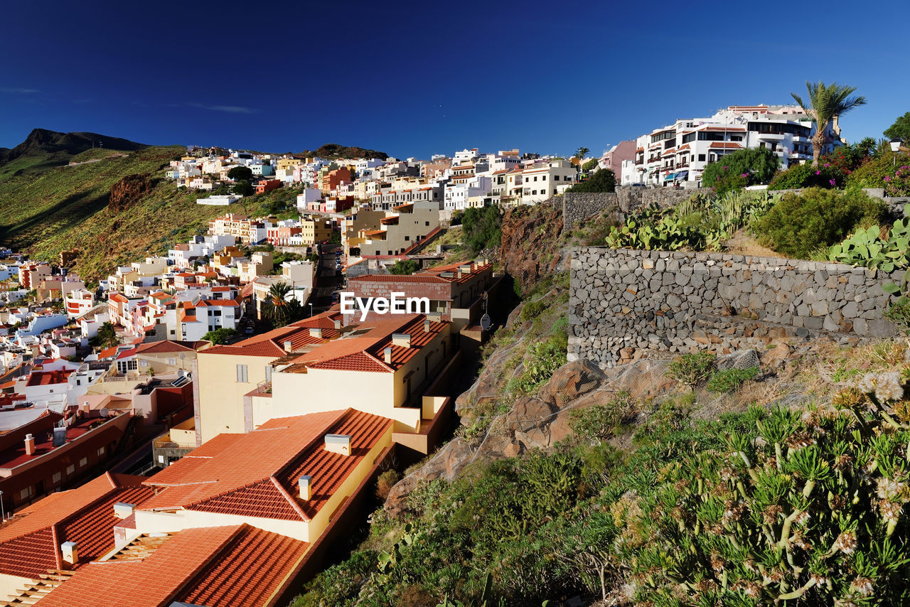 High angle view of buildings against clear sky at san sebastian de la gomera