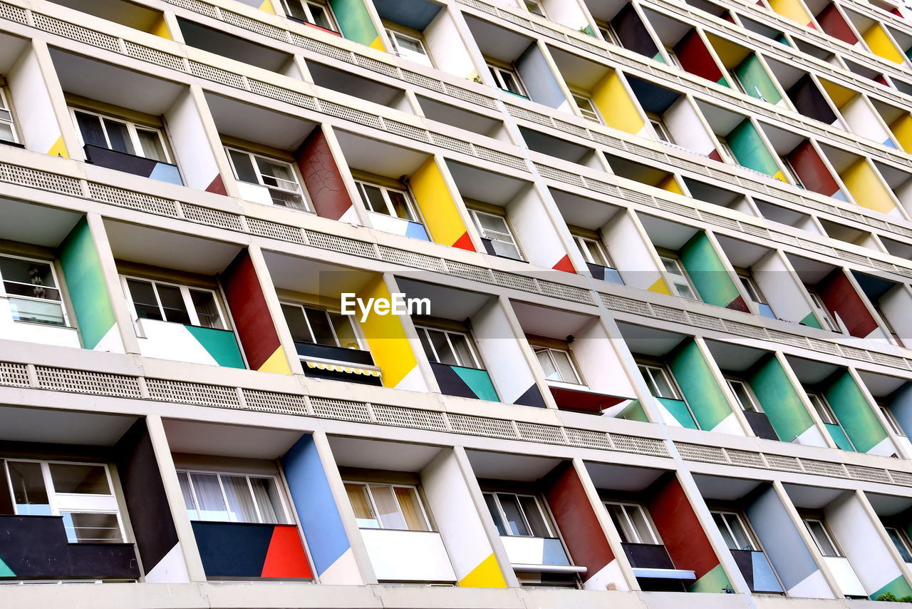 LOW ANGLE VIEW OF BUILDING WITH WINDOWS