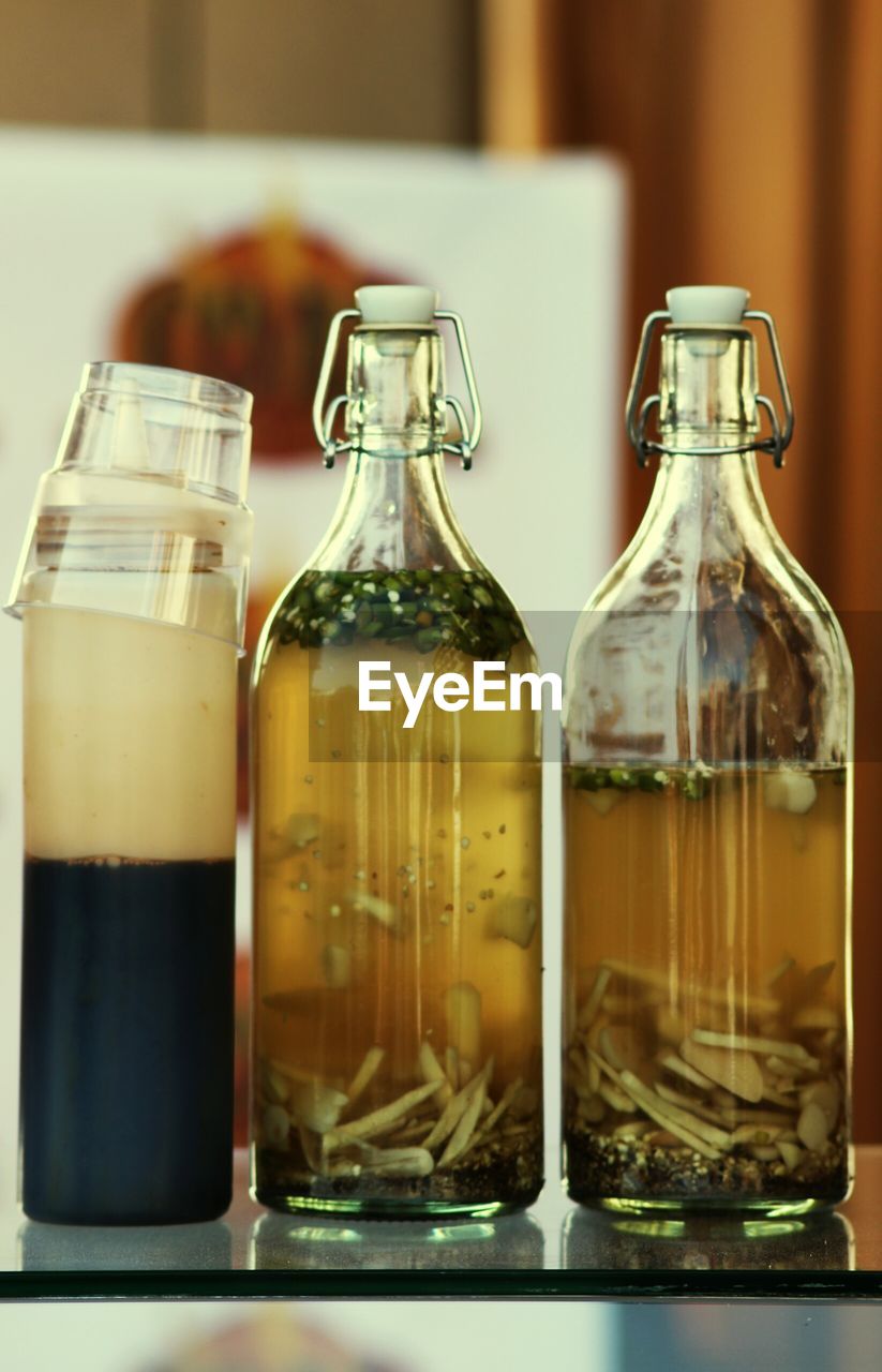 Close-up of drink in bottles on table