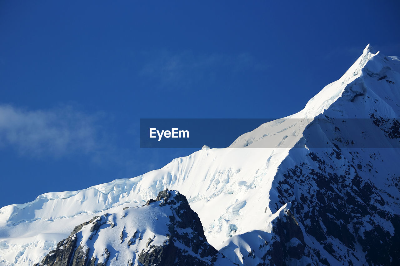 Snow on rocky mountain peak