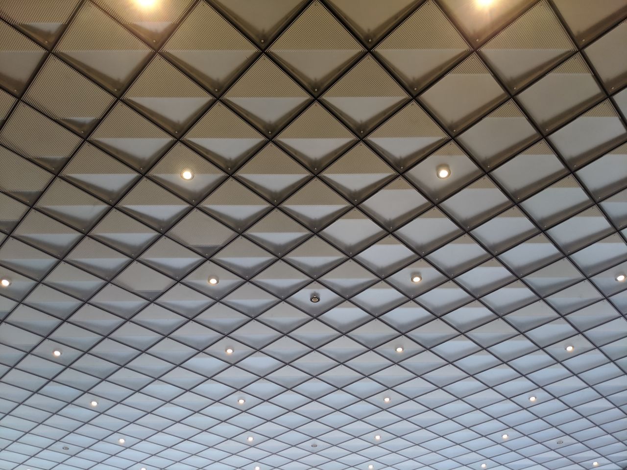 LOW ANGLE VIEW OF ILLUMINATED CEILING OF BUILDING