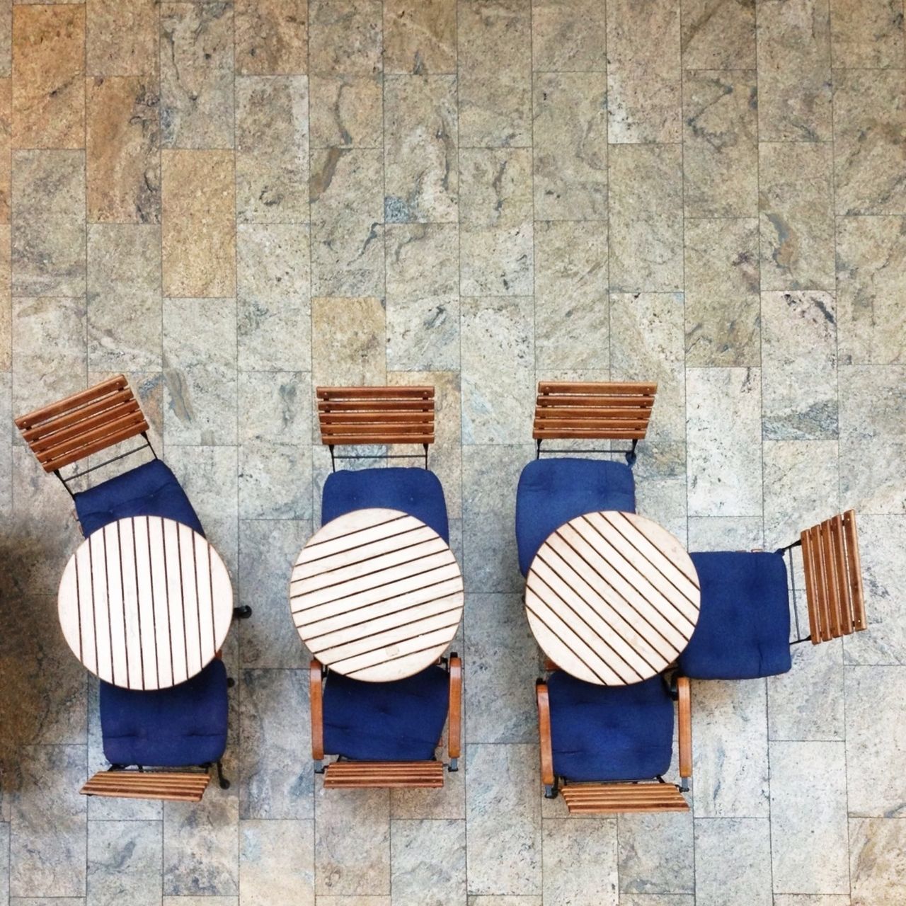 High angle view of chairs and tables arranged in cafe