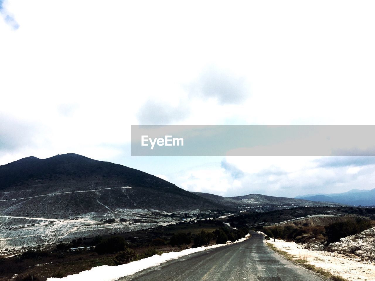 ROAD PASSING THROUGH MOUNTAINS