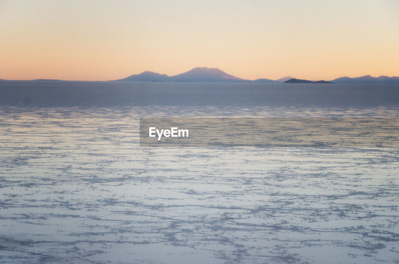 SCENIC VIEW OF SNOW COVERED MOUNTAIN AGAINST SKY