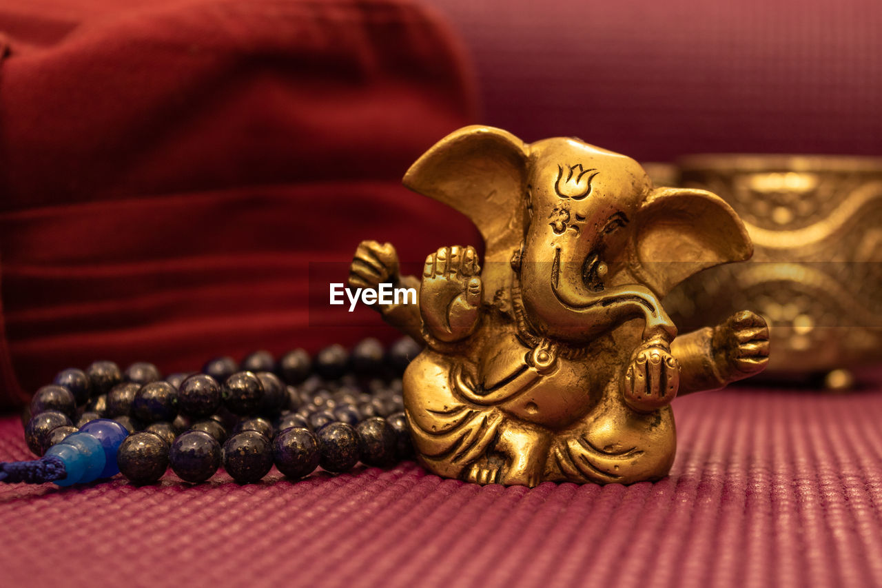 Close-up of ganesha figurine on table