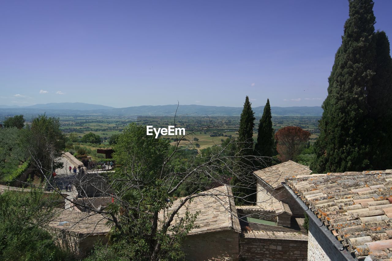 High angle view of houses and trees against sky