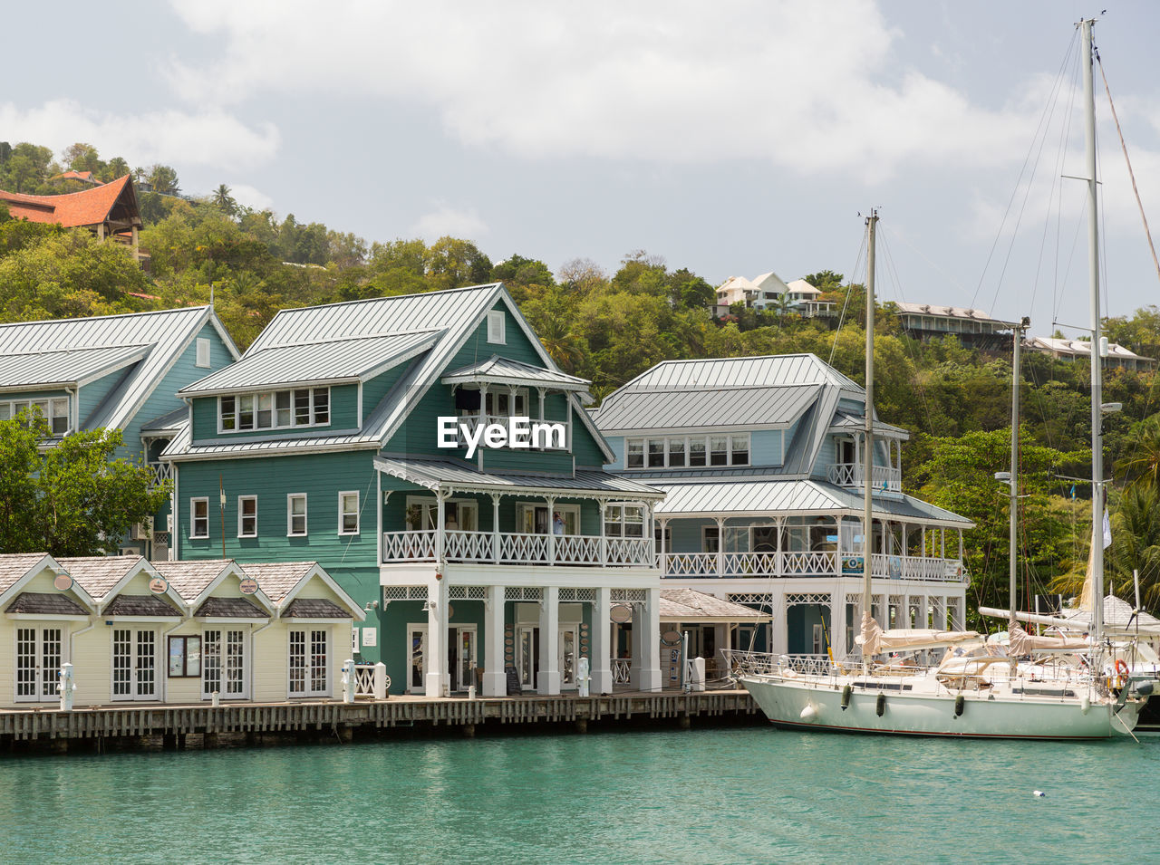 HOUSES BY SEA AGAINST SKY