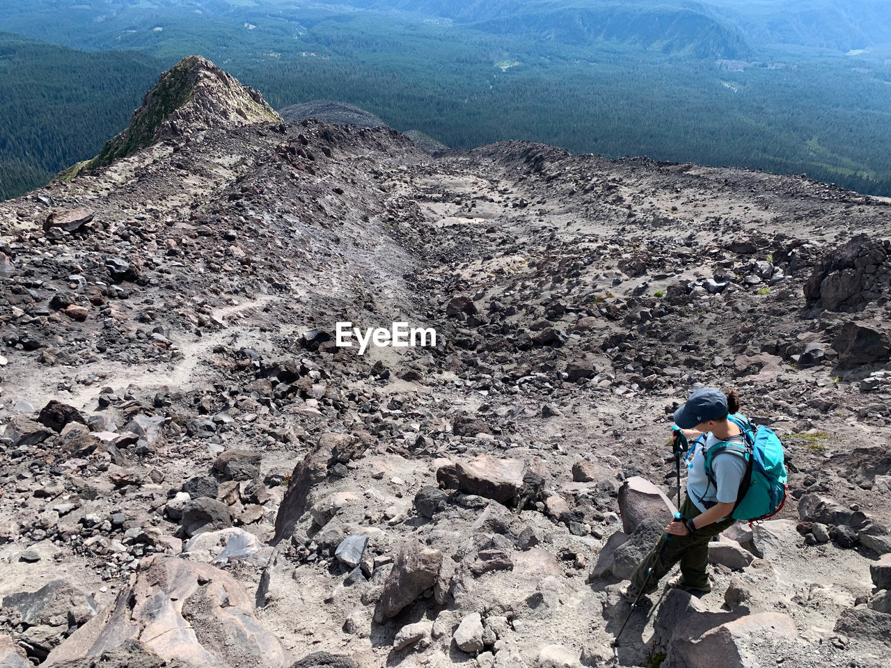 High angle view of woman hiking on mountain