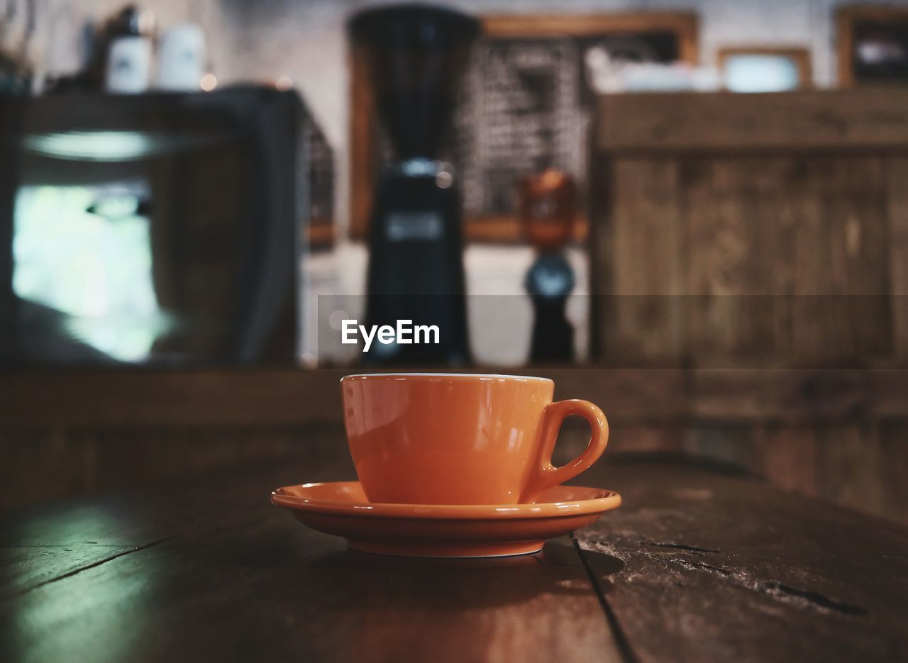 Close-up of coffee cup on table