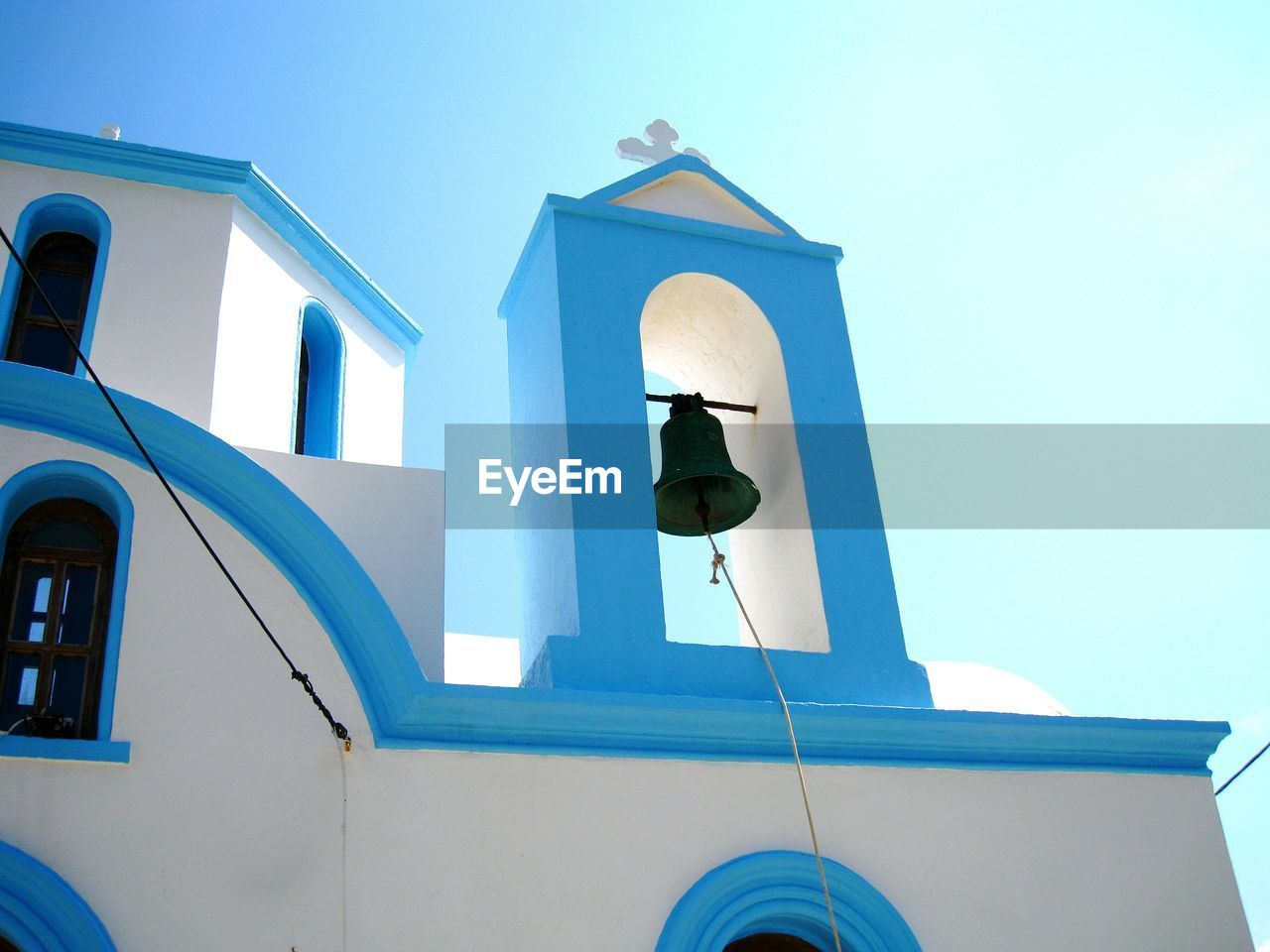 Low angle view of bell tower against clear sky