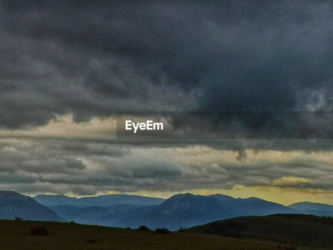 SCENIC VIEW OF DRAMATIC SKY OVER MOUNTAINS