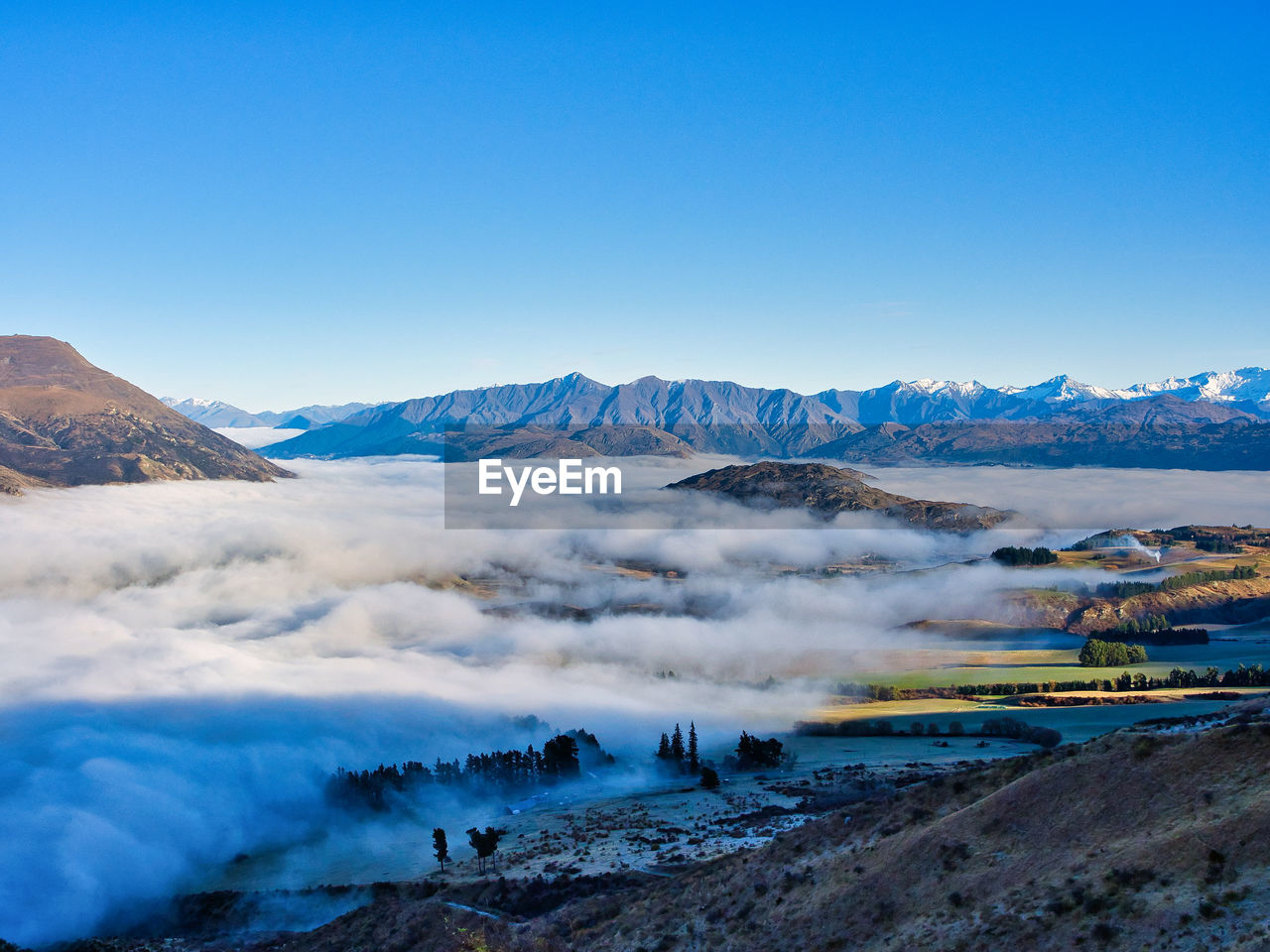 SCENIC VIEW OF VOLCANIC MOUNTAIN AGAINST BLUE SKY
