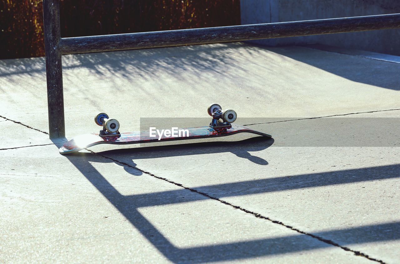 HIGH ANGLE VIEW OF TOY ON SKATEBOARD