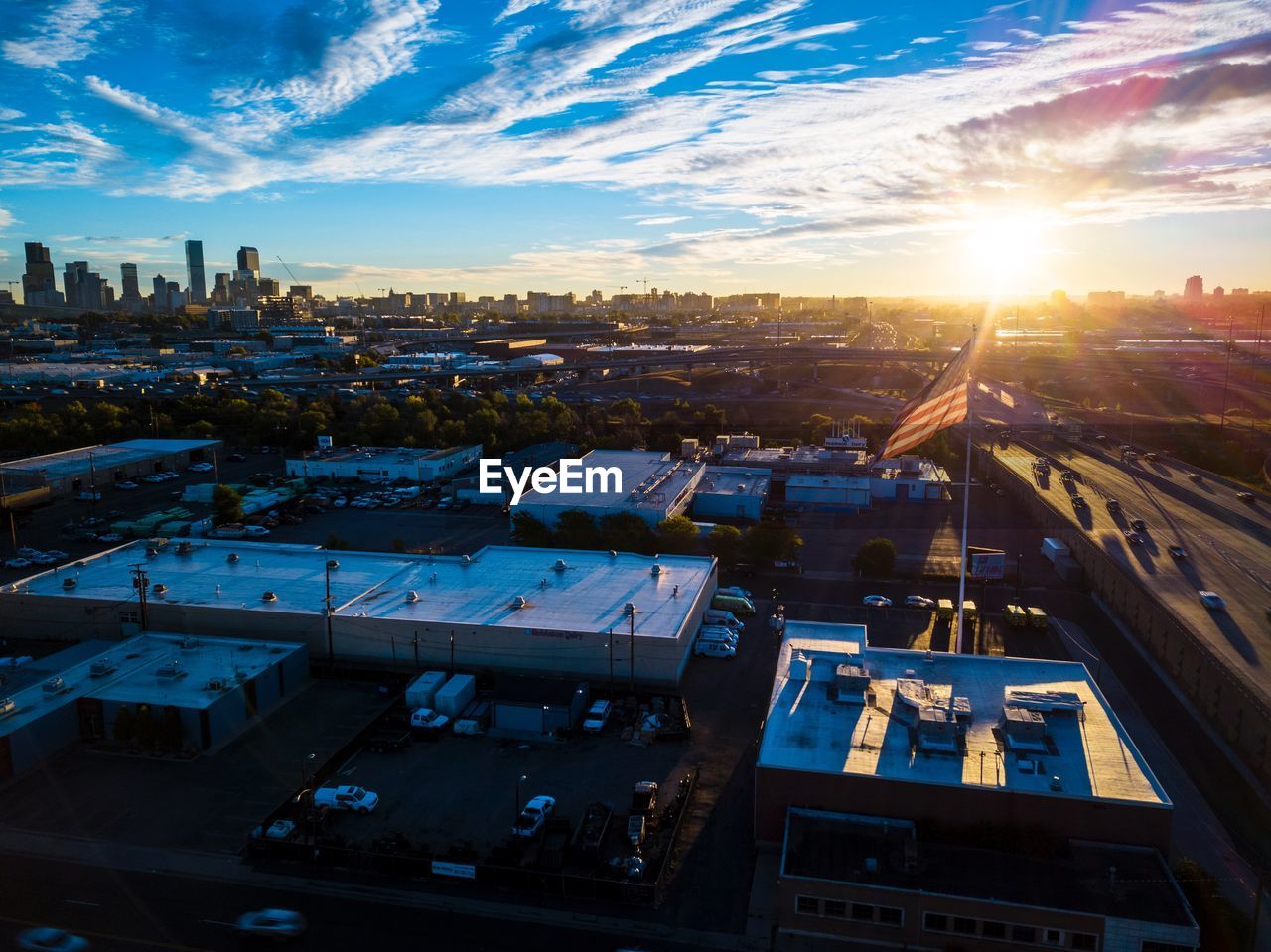 High angle view of buildings in city against sky during sunset