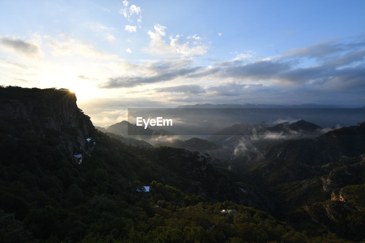 Scenic view of landscape against sky during sunset