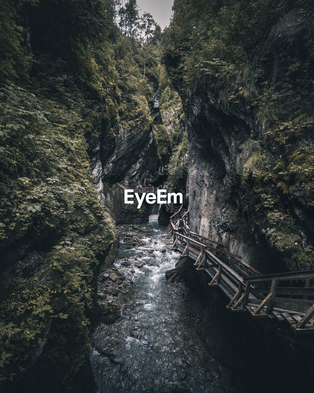 Scenic view of bridge amidst rock formation