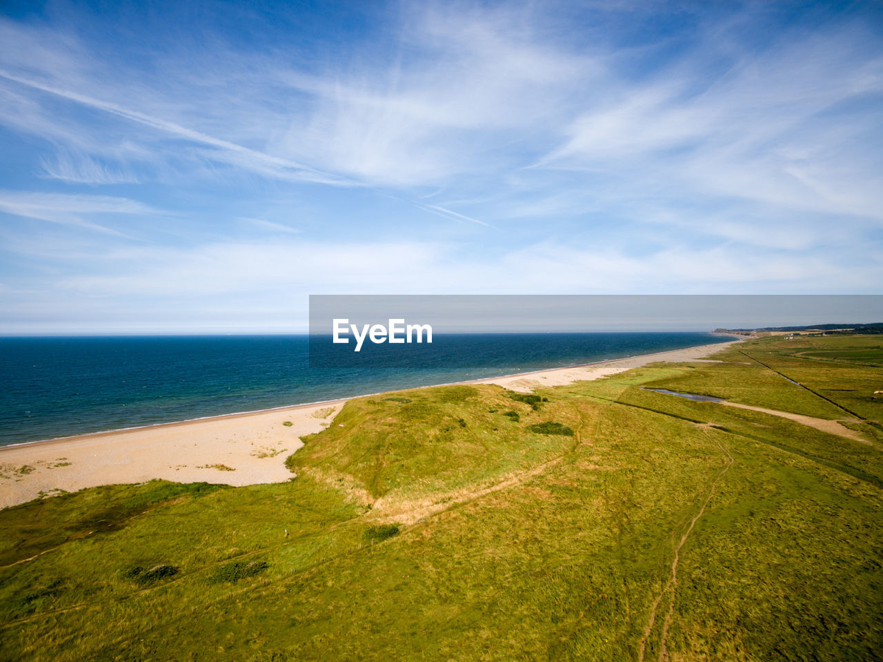 Scenic view of beach against clear sky