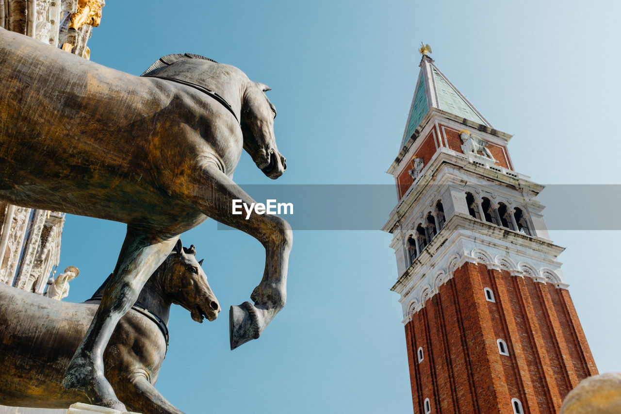 Low angle view of statue and tower at church of san giorgio maggiore