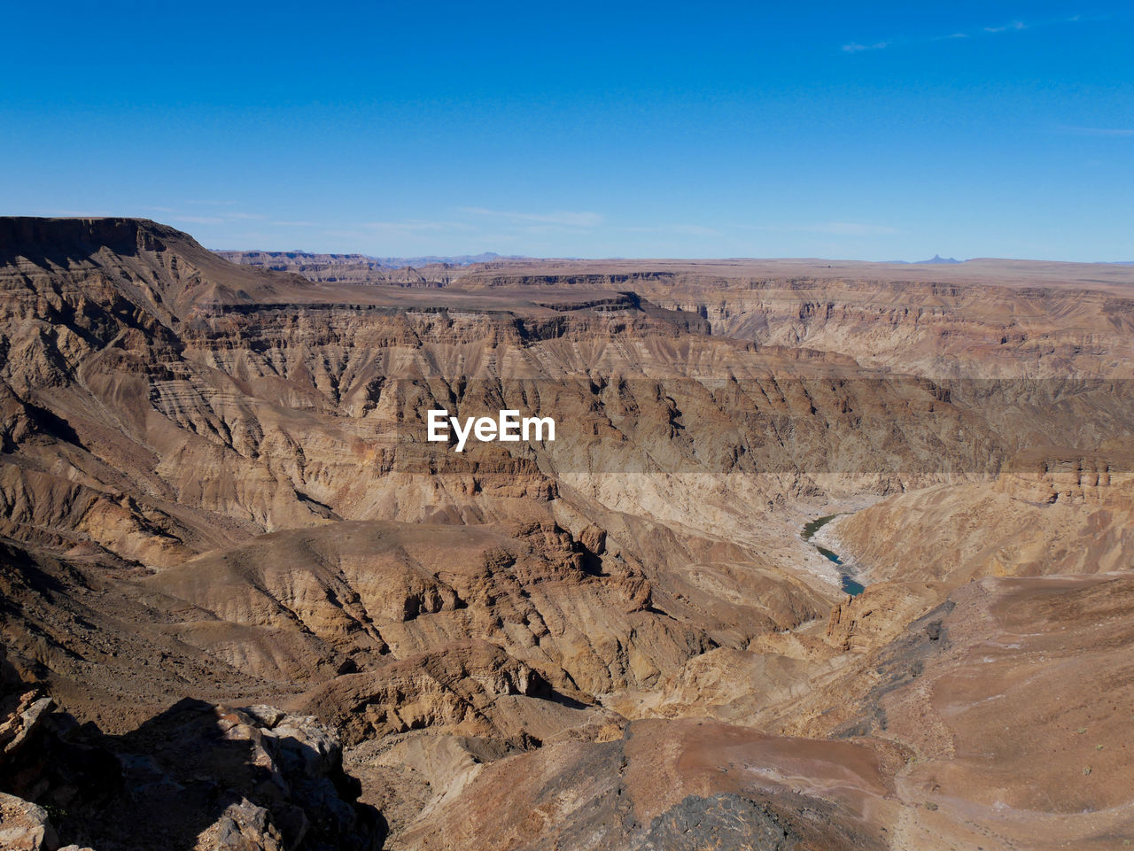 rock formations in desert against clear sky