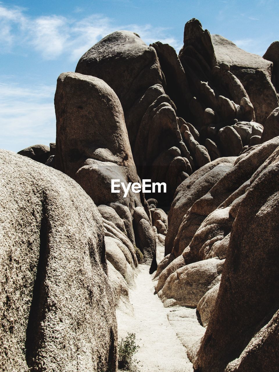 LOW ANGLE VIEW OF ROCK FORMATIONS AGAINST SKY