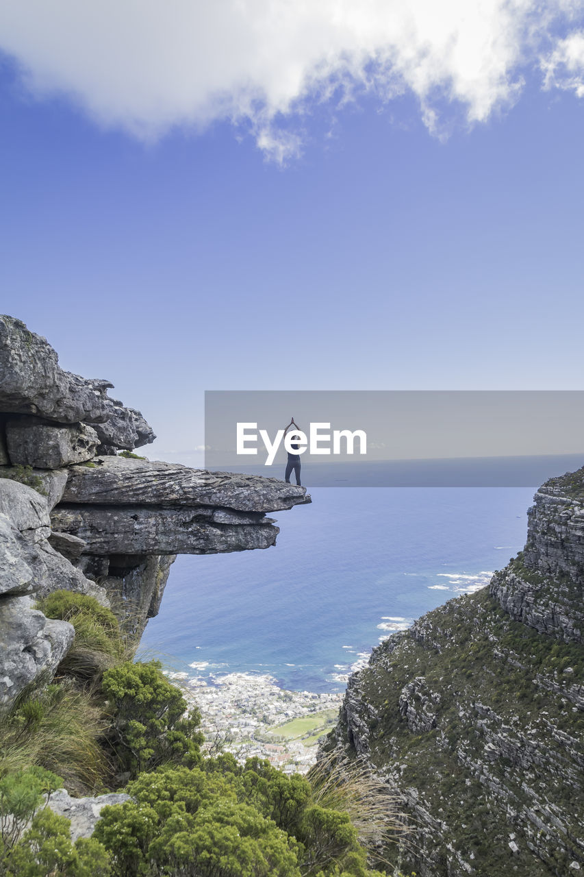 On the edge of a ledge on table mountain. kasteelpoort.